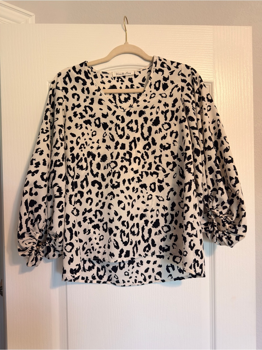Vine & Love Black and White Leopard Print V-Neck Blouse